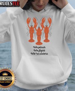 Alt Text: Sisters wearing 'Good We Pinch We Fight We're Sisters' lobster hoodie, smiling together in a casual setting.