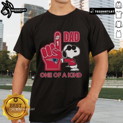 Alt Text: Happy Snoopy wearing a New England Patriot Dad t-shirt, showcasing a unique design for sports fans and fathers.