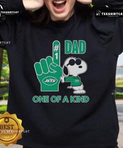 Happy Snoopy wearing a New York Jets sweatshirt, showcasing a unique DAD design for football fans.