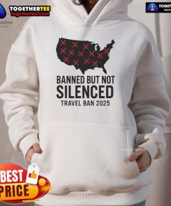 Alt Text: Protestor wearing 'Hot Banned But Not Silenced' hoodie during 2025 Trump travel ban protest, showcasing resistance.