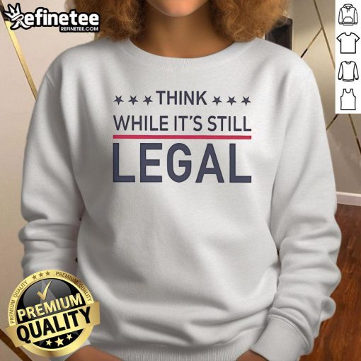 Rihanna wearing a stylish 'Think While It's Still Legal' sweatshirt, showcasing a trendy urban fashion look.