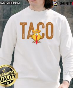 Funny sweatshirt featuring 'Hot Taco Trump Always Chickens Out' graphic, perfect for humor and political satire lovers.
