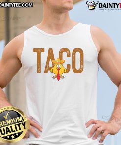 Funny tank top featuring a cartoon of Trump with a taco, captioned Hot Taco Trump Always Chickens Out. Perfect for humor!