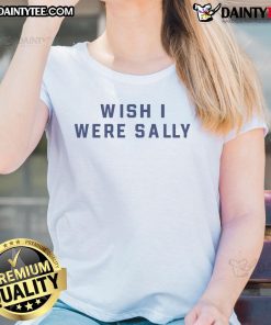 Conan Gray wearing 'Wish I Were Sally' ladies tee, showcasing a stylish and casual look in a vibrant setting.