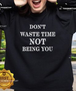 Cozy 'Don't Waste Time Not Being You' sweatshirt in a stylish design, perfect for casual wear and self-expression.