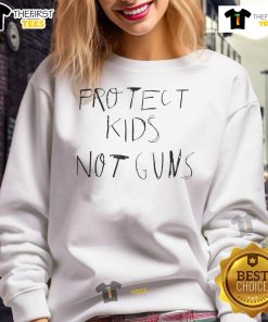 Giannis Antetokounmpo wearing a 'Protect Kids Not Guns' sweatshirt, promoting a message of peace and safety.