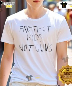 Alt Text: Giannis Antetokounmpo wearing a Protect Kids Not Guns T-shirt, promoting a vital message on gun violence awareness.