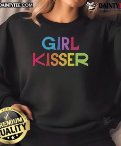 Girl wearing a red 'Nice Girl' sweatshirt, playfully kissing another girl, showcasing a fun and vibrant friendship.
