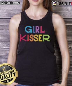 Nice girl in red tank top kisses her friend, showcasing a vibrant summer style and playful friendship vibes.