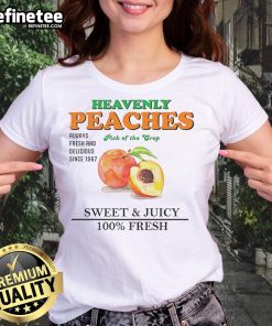 Sweet and juicy Nice Heavenly peaches on a fresh ladies tee, showcasing the crop's vibrant colors and freshness.