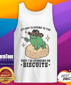 Model wearing 'Nice It's Not Clocking To You That I'm Standing On Biscuits' tank top, showcasing a trendy, humorous design.