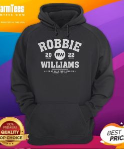 Robbie Williams performing live at Vale Park Stadium on June 4, wearing a hoodie, captivating the audience with his music.