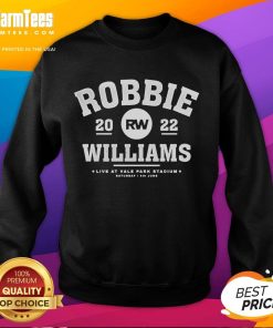 Robbie Williams performing live at Vale Park Stadium on June 4th, wearing a stylish sweatshirt during the concert.