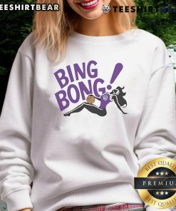 Girl wearing a Sacramento Kings Bing Bong sweatshirt, showcasing team spirit and style in vibrant colors.