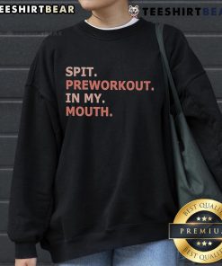 Person wearing a Nice Spit Preworkout sweatshirt, showcasing fitness enthusiasm and style during workout preparation.
