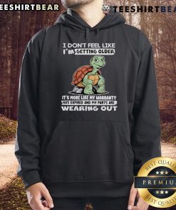 Alt Text: Cozy hoodie featuring a turtle graphic and a humorous quote about aging, perfect for casual wear enthusiasts.