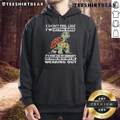Alt Text: Cozy hoodie featuring a turtle graphic and a humorous quote about aging, perfect for casual wear enthusiasts.