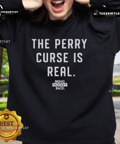 Alt Text: Official Bring Hockey Back The Perry Curse Is Real Sweatshirt featuring bold graphics and cozy design for fans.