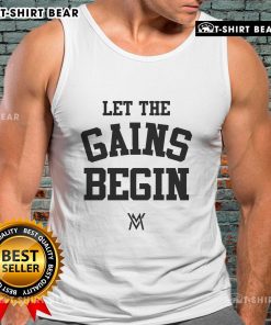 Alt Text: Calum Von Moger wearing 'Let The Gains Begin' tank top, showcasing fitness style and motivation for gym enthusiasts.