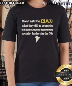 Official 'Don't Ask The CIA' Ladies Tee featuring bold text on the impact of CIA actions in South Americas socialist countries.