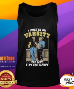 Official I Must Be On Varsity tank top featuring a stylish design, perfect for sports fans and team spirit wear.