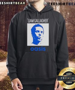 Alt Text: Liam Gallagher wearing an Oasis hoodie, showcasing his iconic style in a striking portrait. Official merchandise.