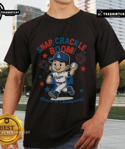 Official Los Angeles Dodgers Independence Day T-Shirt featuring 'Snap Crackle Boom' design celebrating champions.