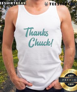 Mark Hamill wears a 'Thanks Chuck' tank top, showcasing a casual style and unique fan tribute at an event.