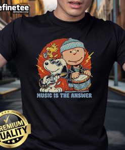 Alt Text: Official Music Is The Answer Peanuts Snoopy T-Shirt featuring Snoopy with musical notes on a vibrant background.