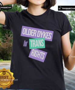 Alt Text: Official Older Dykes for Trans Rights Ladies Tee featuring bold text on a stylish black t-shirt design.
