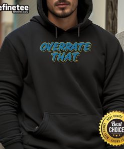 Alt Text: Pat McAfee wearing the 'Overrate That' hoodie, showcasing his unique style and personality in a casual setting.