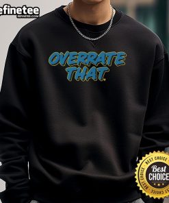 Alt Text: Pat McAfee wearing an Overrate That sweatshirt, showcasing his unique style and personality in a casual setting.