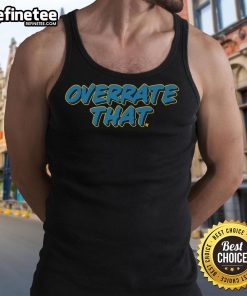 Pat McAfee wearing an 'Overrate That' tank top, showcasing his unique style and personality in a casual setting.