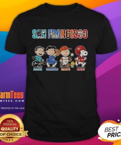 Alt Text: Official Peanuts T-Shirt featuring San Francisco Sharks, Warriors, Giants, and 49ers logos, perfect for sports fans.