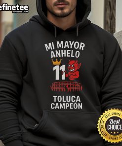 Alt Text: Official Playera Tirando Rostro Mi Mayor Anhelo 11 Toluca Campeon Hoodie featuring bold design and vibrant colors.