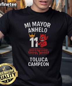 Alt Text: Official Playera Tirando Rostro Mi Mayor Anhelo 11 Toluca Campen T-Shirt featuring vibrant team graphics and colors.