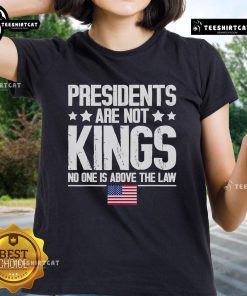 Alt Text: USA flag graphic on 'Official Presidents Are Not Kings' ladies tee, emphasizing no one is above the law in America.