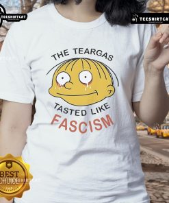 Official Ralph Wiggum 'The Teargas Tastes Like Fascism' Ladies Tee featuring a playful graphic and vibrant colors.