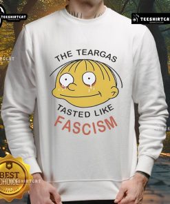 Official Ralph Wiggum sweatshirt featuring 'The Teargas Tastes Like Fascism' design, perfect for fans of The Simpsons.