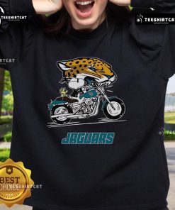 Alt Text: Official Snoopy and Woodstock driving motorbike on Jacksonville Jaguars sweatshirt, perfect for fans and collectors.