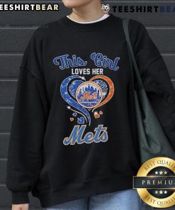 Alt Text: Woman wearing an Official New York Mets sweatshirt, showcasing her love for the team in vibrant colors.