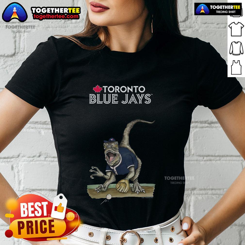 Official Toronto Blue Jays Tiny Turnip Velociraptor Ladies Tee Alt Text: Official Toronto Blue Jays Tiny Turnip Velociraptor Ladies Tee featuring a fun dinosaur graphic for fans.