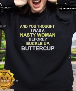 Alt Text: Whoopi Goldberg wearing the You Thought I Was A Nasty Woman? Buckle Up, Buttercup! sweatshirt.