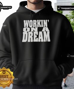 Alt Text: Official Workin' On A Dream Hoodie, featuring a stylish design perfect for casual wear and inspiring creativity.