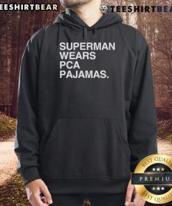Original Superman wearing PCA pajamas hoodie, showcasing a unique blend of superhero style and comfort.