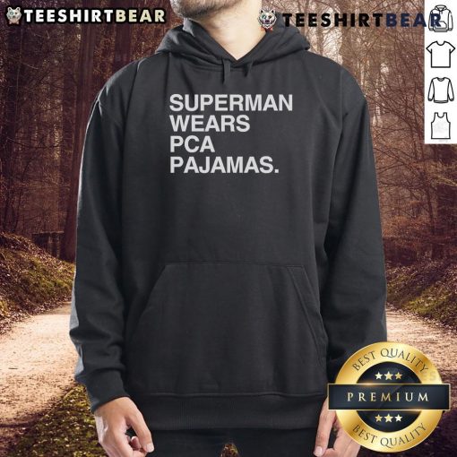 Original Superman wearing PCA pajamas hoodie, showcasing a unique blend of superhero style and comfort.