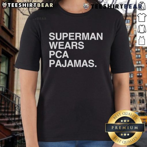 Alt Text: Lady wearing Original Superman PCA pajamas tee, showcasing a vibrant design and comfortable fit for superhero fans.