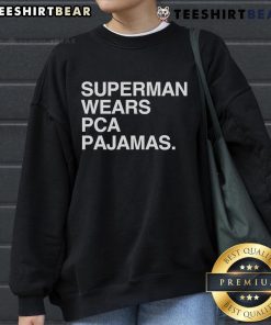 Original Superman wearing PCA pajamas sweatshirt, showcasing a unique superhero style and vibrant colors.
