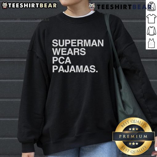 Original Superman wearing PCA pajamas sweatshirt, showcasing a unique superhero style and vibrant colors.