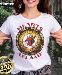 Premium Hearts Aflame Filthy Lucre logo on a stylish ladies tee, perfect for fashion-forward women.
